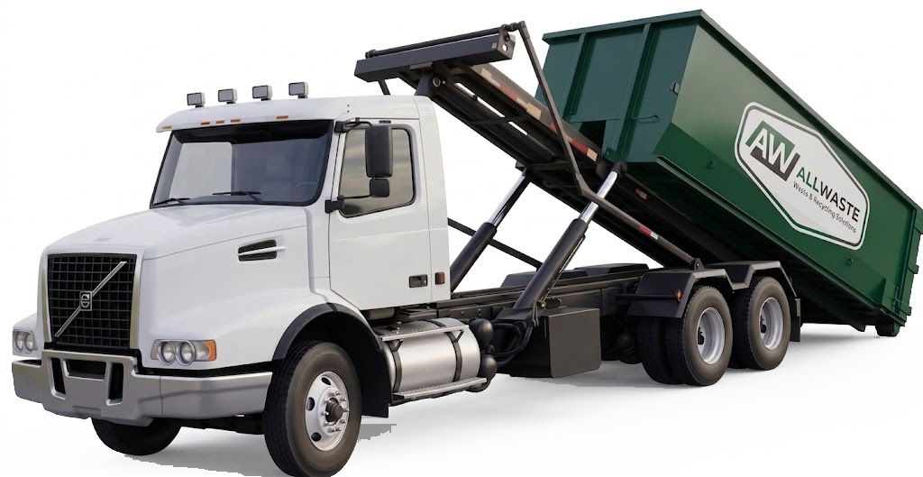 All Waste roll-off truck delivering a container to a commercial site