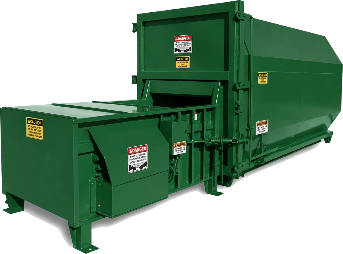 Self-contained compactor beside a loading dock