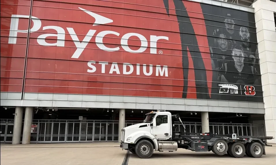Roll-off truck parked outside Paycor Stadium in downtown Cincinnati